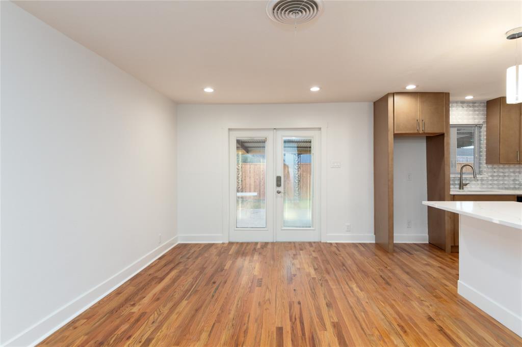 1241 Stevens Ridge Drive Dallas, TX 75211 - Photo 9 of 18 a view of wooden floor and a kitchen