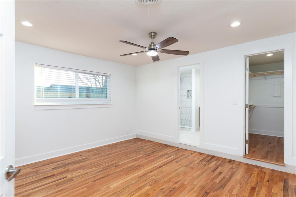 1241 Stevens Ridge Drive Dallas, TX 75211 - Photo 10 of 18 a view of empty room with wooden floor and fan