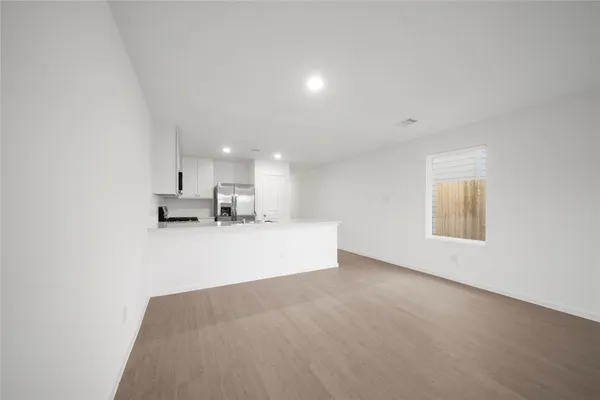 a view of kitchen and kitchen with sink