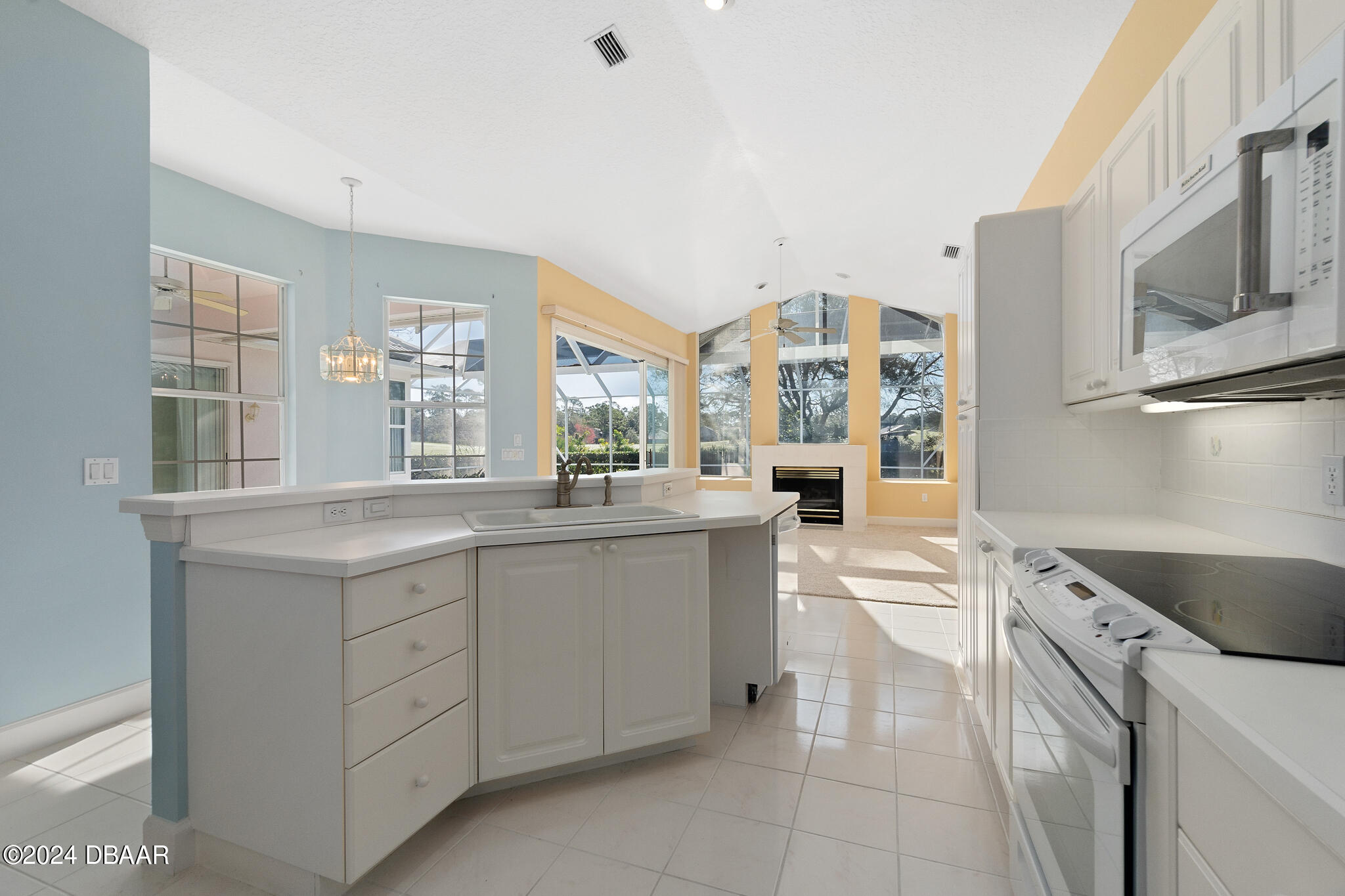 710 Dolphin Head Lane Ormond Beach, FL 32174 - Photo 11 of 42 a kitchen with a sink and cabinets