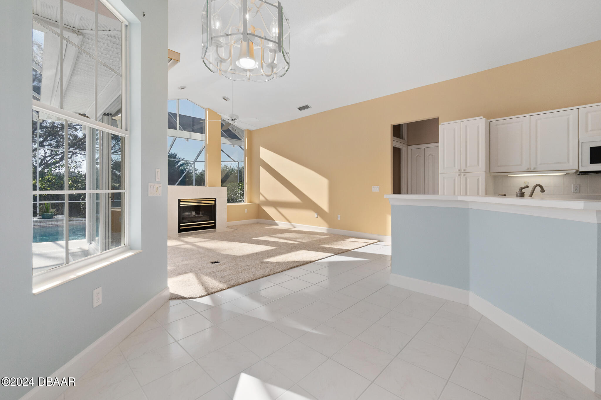 710 Dolphin Head Lane Ormond Beach, FL 32174 - Photo 12 of 42 a view of a kitchen with furniture and windows