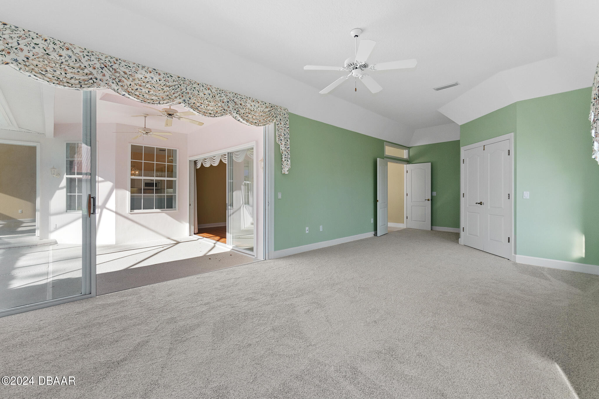 710 Dolphin Head Lane Ormond Beach, FL 32174 - Photo 16 of 42 a view of a big room with closet and windows