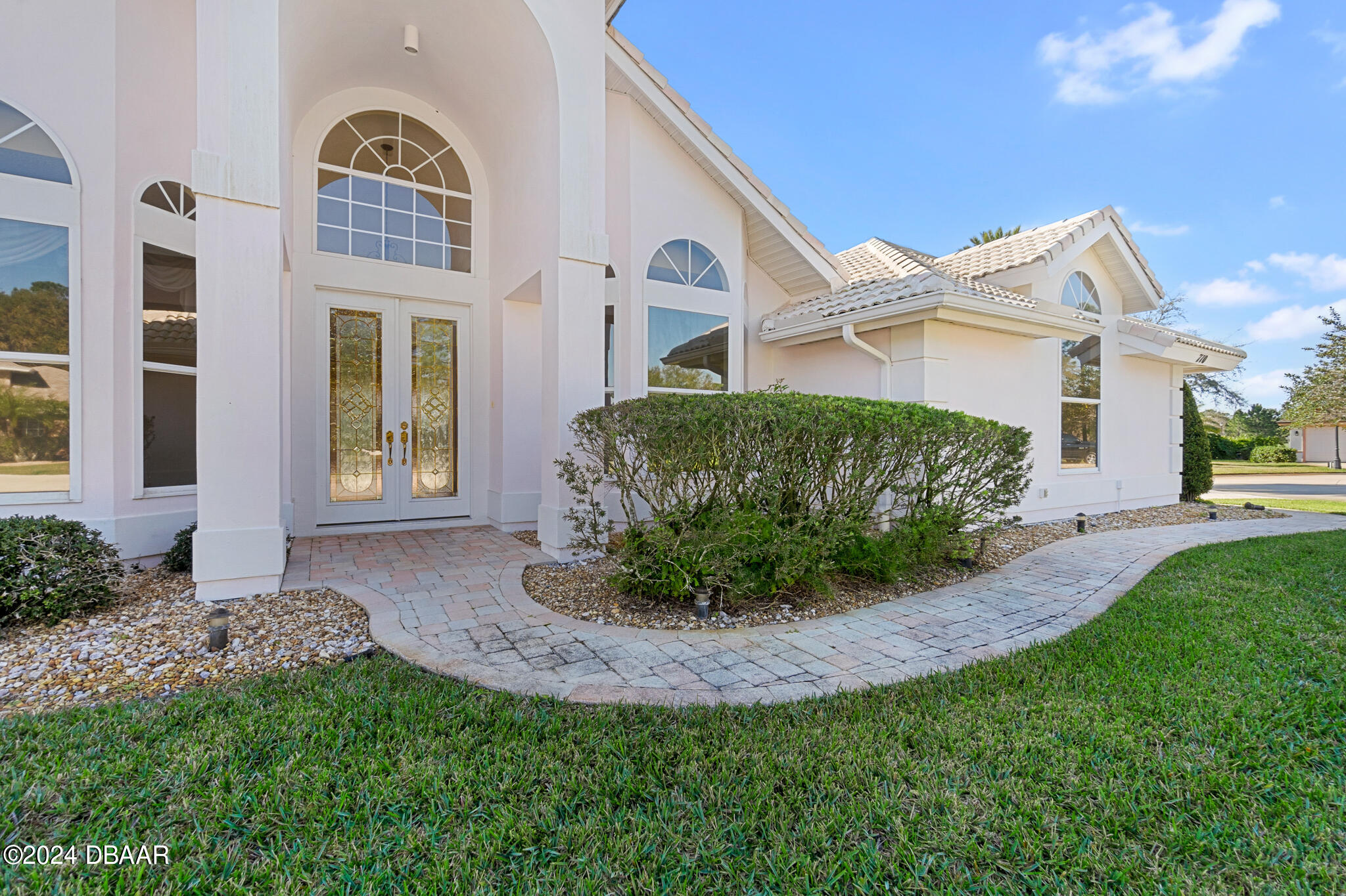 710 Dolphin Head Lane Ormond Beach, FL 32174 - Photo 2 of 42 a front view of a house with a yard