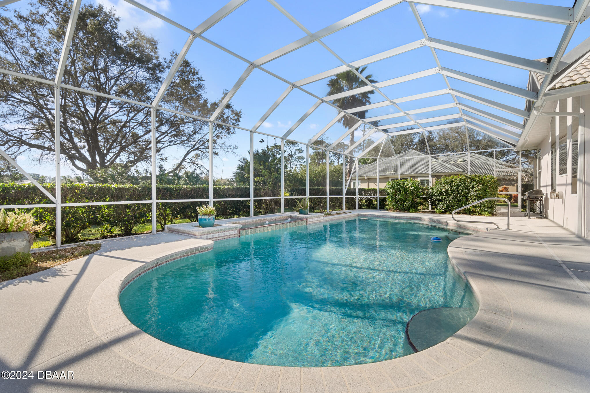 710 Dolphin Head Lane Ormond Beach, FL 32174 - Photo 30 of 42 a view of a backyard with swimming pool