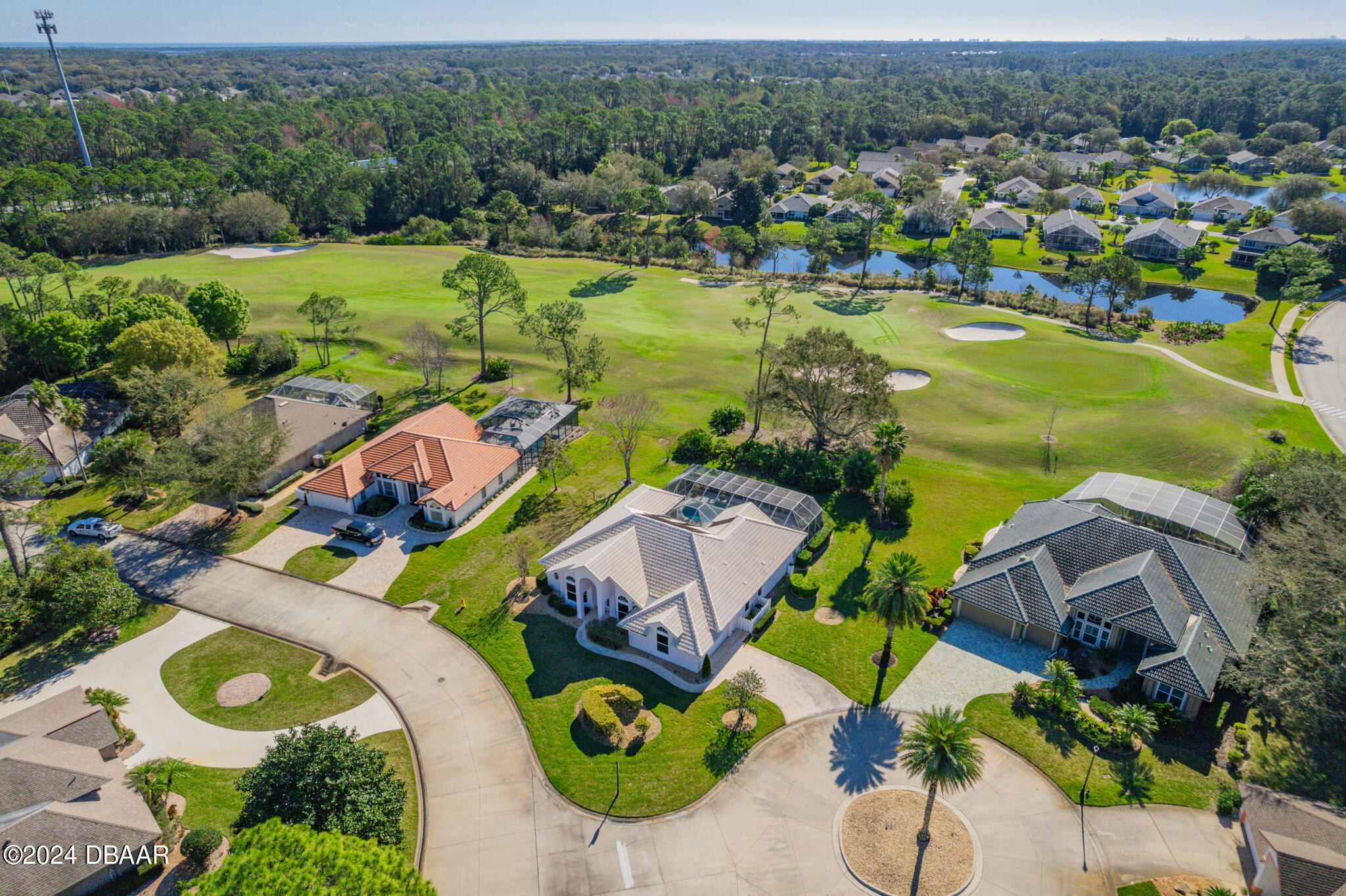 710 Dolphin Head Lane Ormond Beach, FL 32174 - Photo 32 of 42 an aerial view of residential houses with outdoor space and lake view