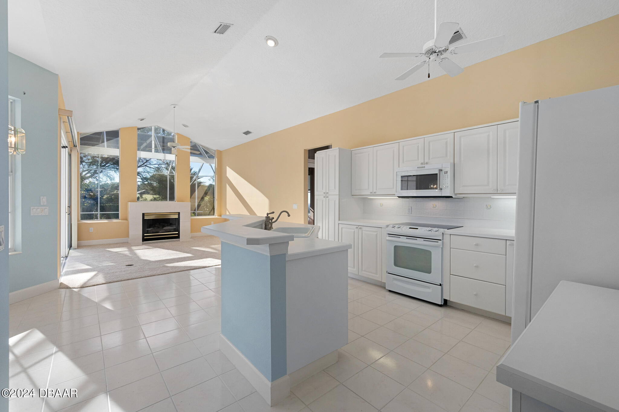 710 Dolphin Head Lane Ormond Beach, FL 32174 - Photo 10 of 42 a kitchen with stainless steel appliances granite countertop a stove and a refrigerator