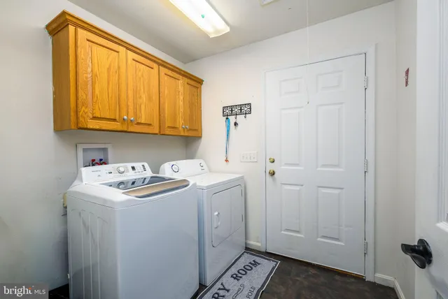 a view of walk in closet with clothes