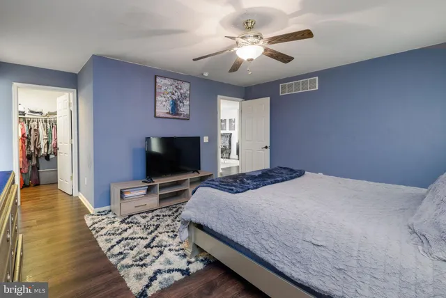 a bathroom with a sink double vanity granite tub shower and a mirror