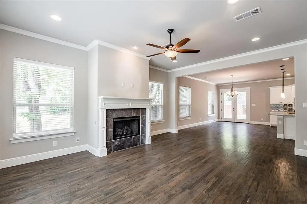 336 Kaye Street Coppell, TX 75019 - Photo 12 of 26 a view of an empty room with wooden floor and a window