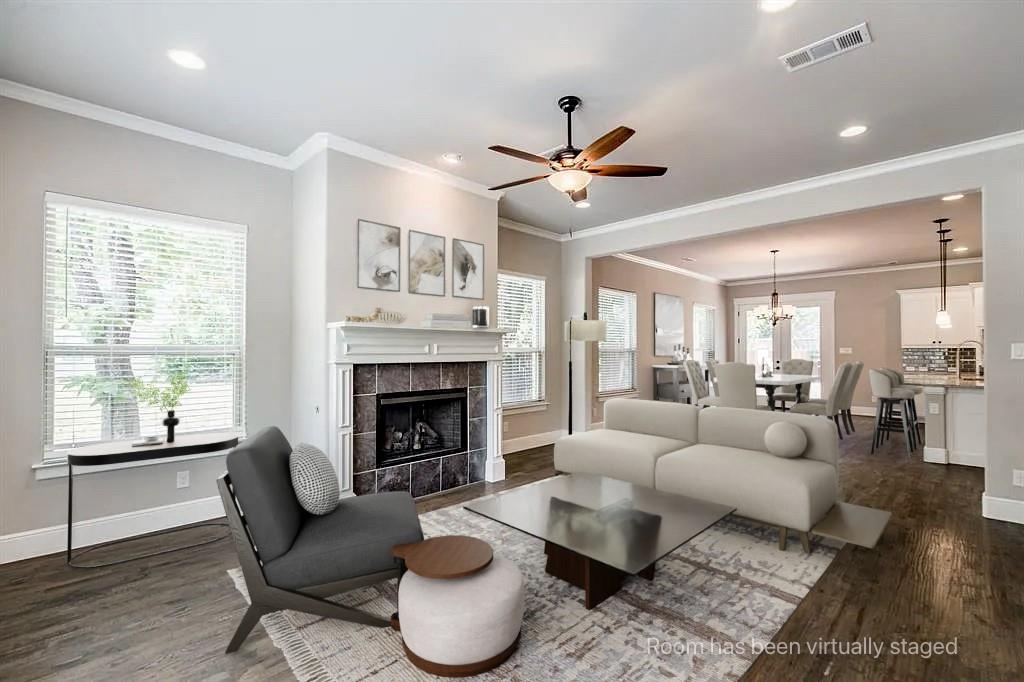 336 Kaye Street Coppell, TX 75019 - Photo 13 of 26 a living room with furniture a fireplace and a large window