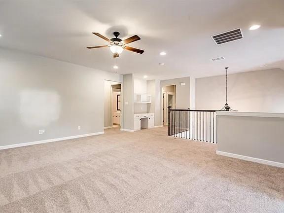 336 Kaye Street Coppell, TX 75019 - Photo 16 of 26 a view of an empty room and a ceiling fan