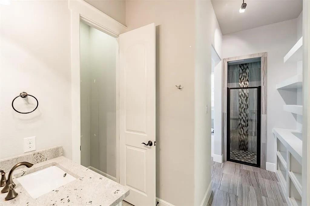 336 Kaye Street Coppell, TX 75019 - Photo 21 of 26 a bathroom with a sink and a mirror