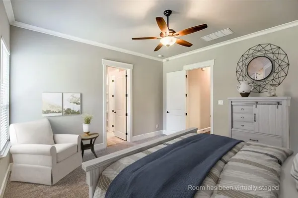 a bedroom with a bed and ceiling fan