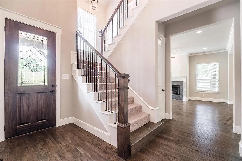 336 Kaye Street Coppell, TX 75019 - Photo 6 of 26 a view of entryway with wooden floor and stairs