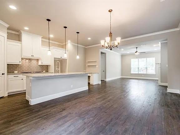 336 Kaye Street Coppell, TX 75019 - Photo 8 of 26 a kitchen with stainless steel appliances granite countertop wooden floors sink and cabinets