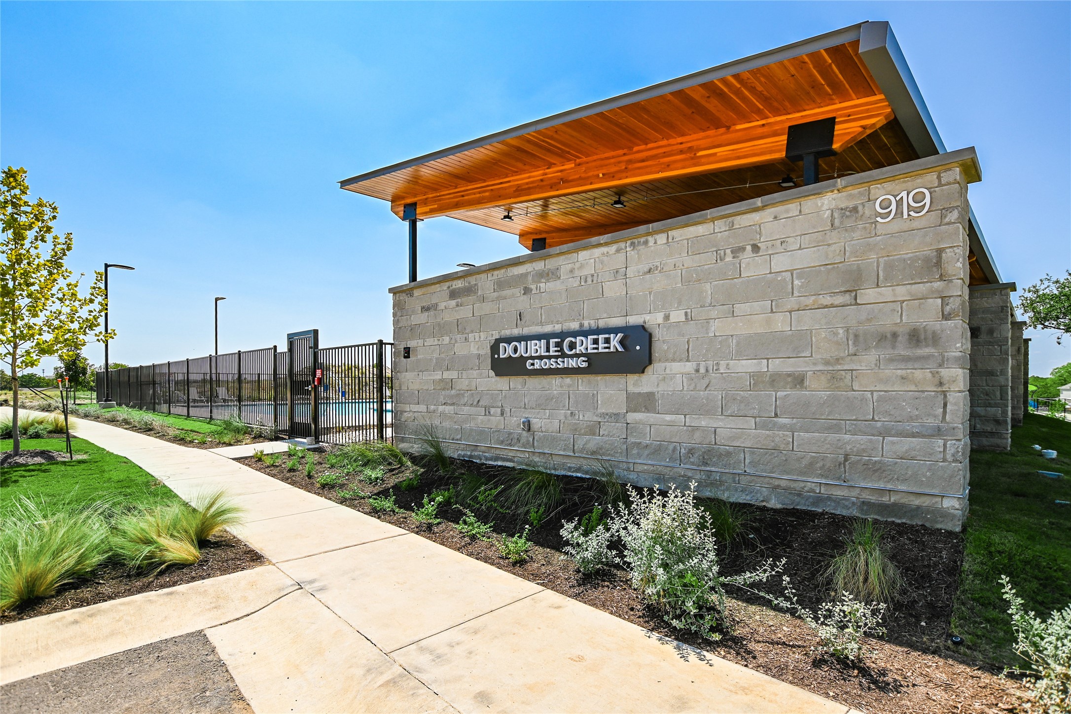 840 Perry Pass, Unit 31 Round Rock, TX 78664 - Photo 4 of 18 Double Creek Pool Entrance
