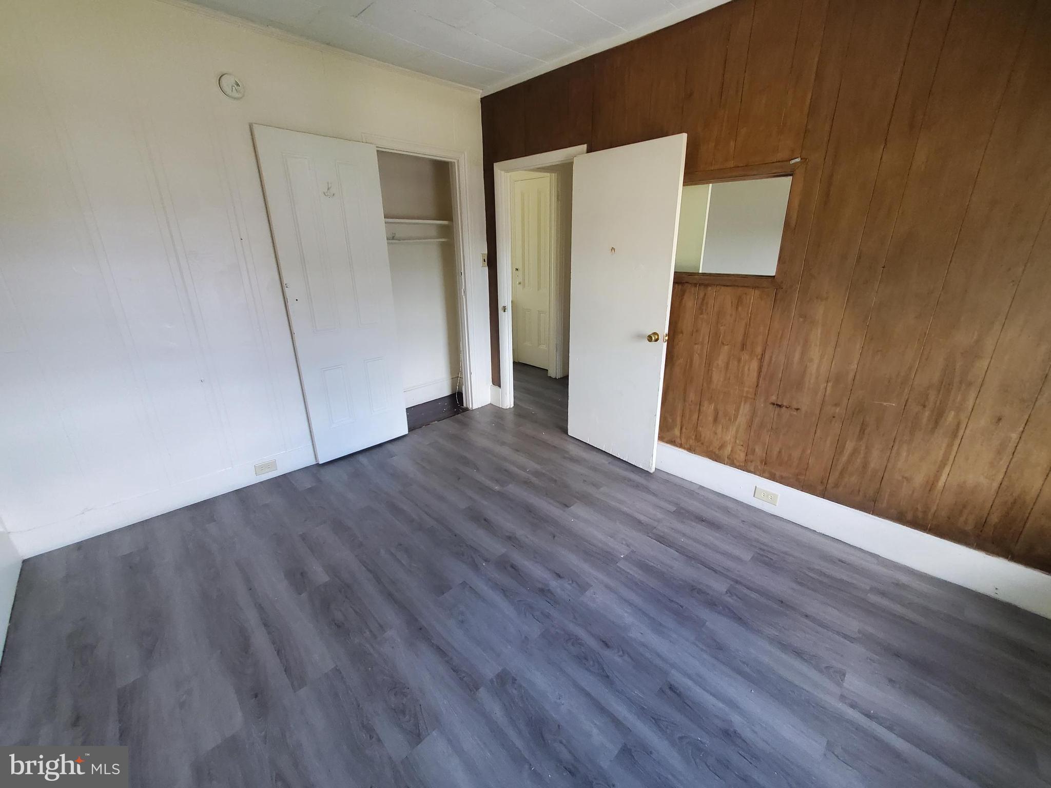 645 North 3rd Street, Unit 3 Reading, PA 19601 - Photo 9 of 10 a view of an empty room with wooden floor and a window
