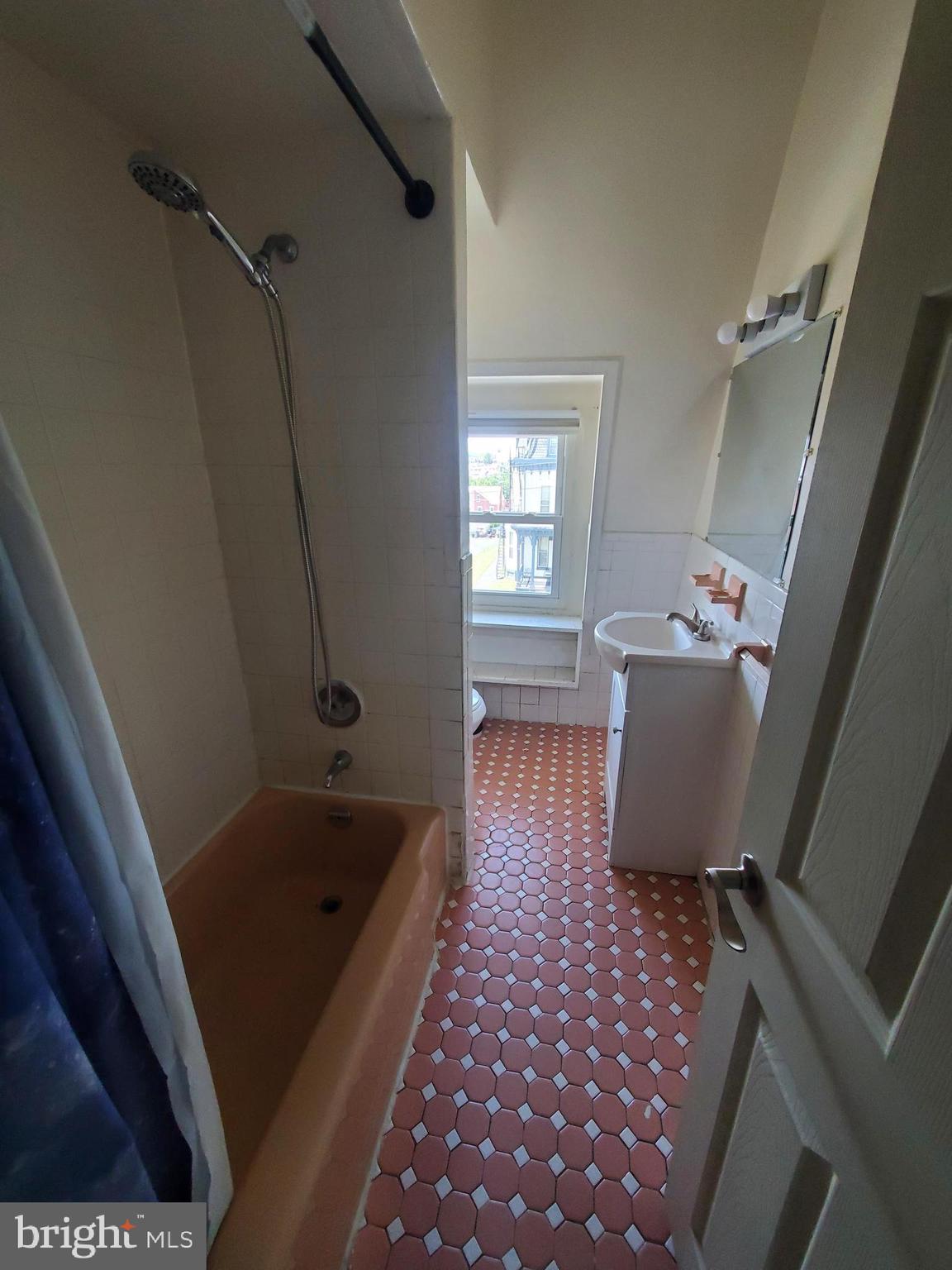 645 North 3rd Street, Unit 3 Reading, PA 19601 - Photo 10 of 10 a bathroom with a bathtub sink and toilet