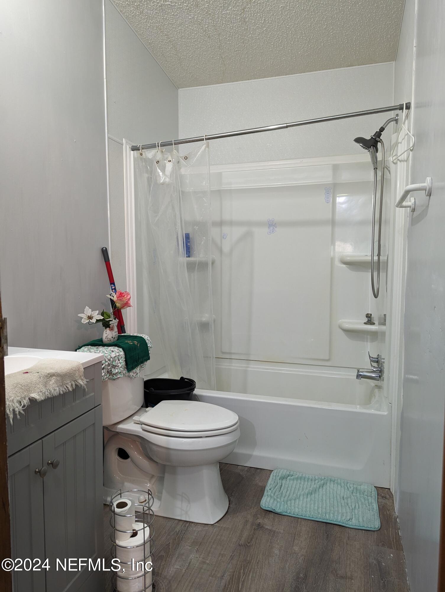 116 Islander Road Satsuma, FL 32189 - Photo 11 of 22 a bathroom with a sink a toilet and shower