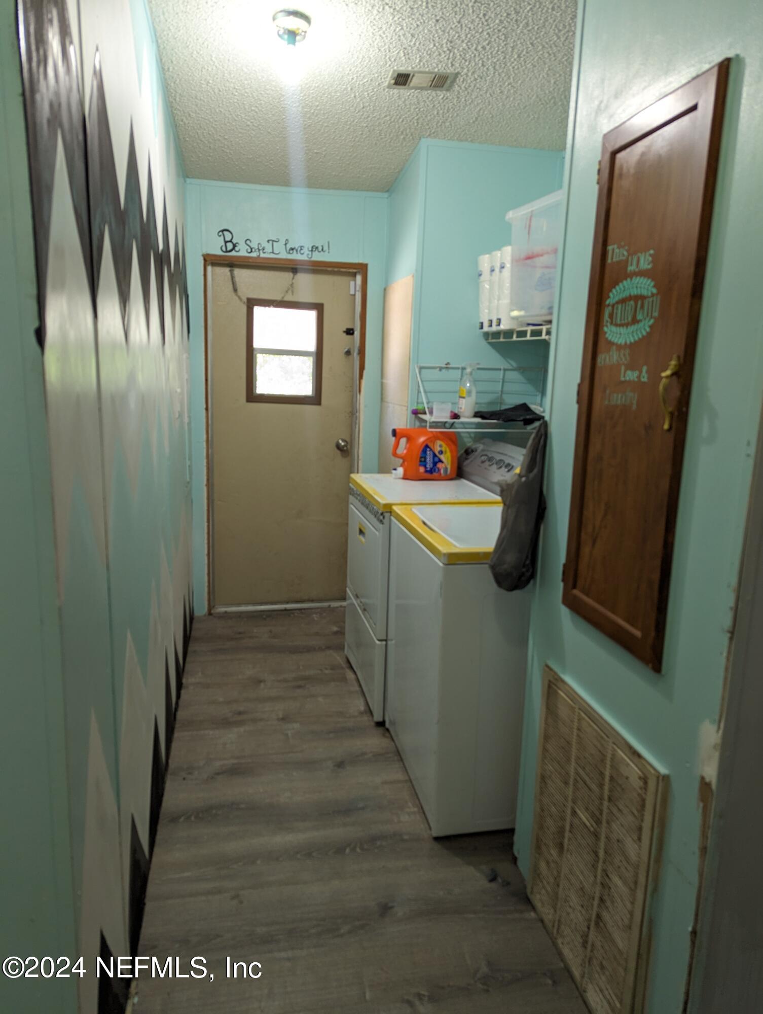 116 Islander Road Satsuma, FL 32189 - Photo 14 of 22 a room with storage and utility