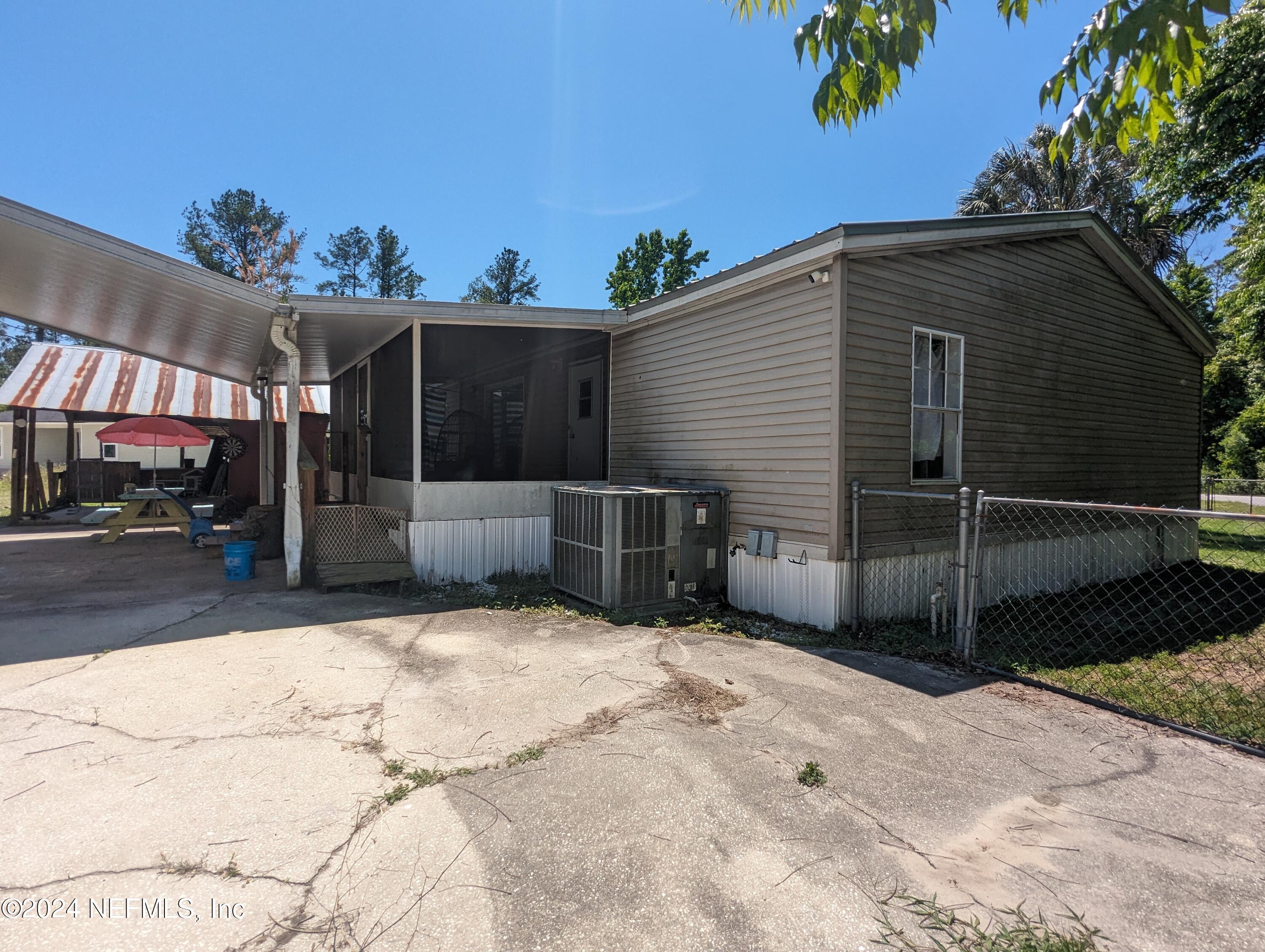 116 Islander Road Satsuma, FL 32189 - Photo 18 of 22 a view of a house with a yard