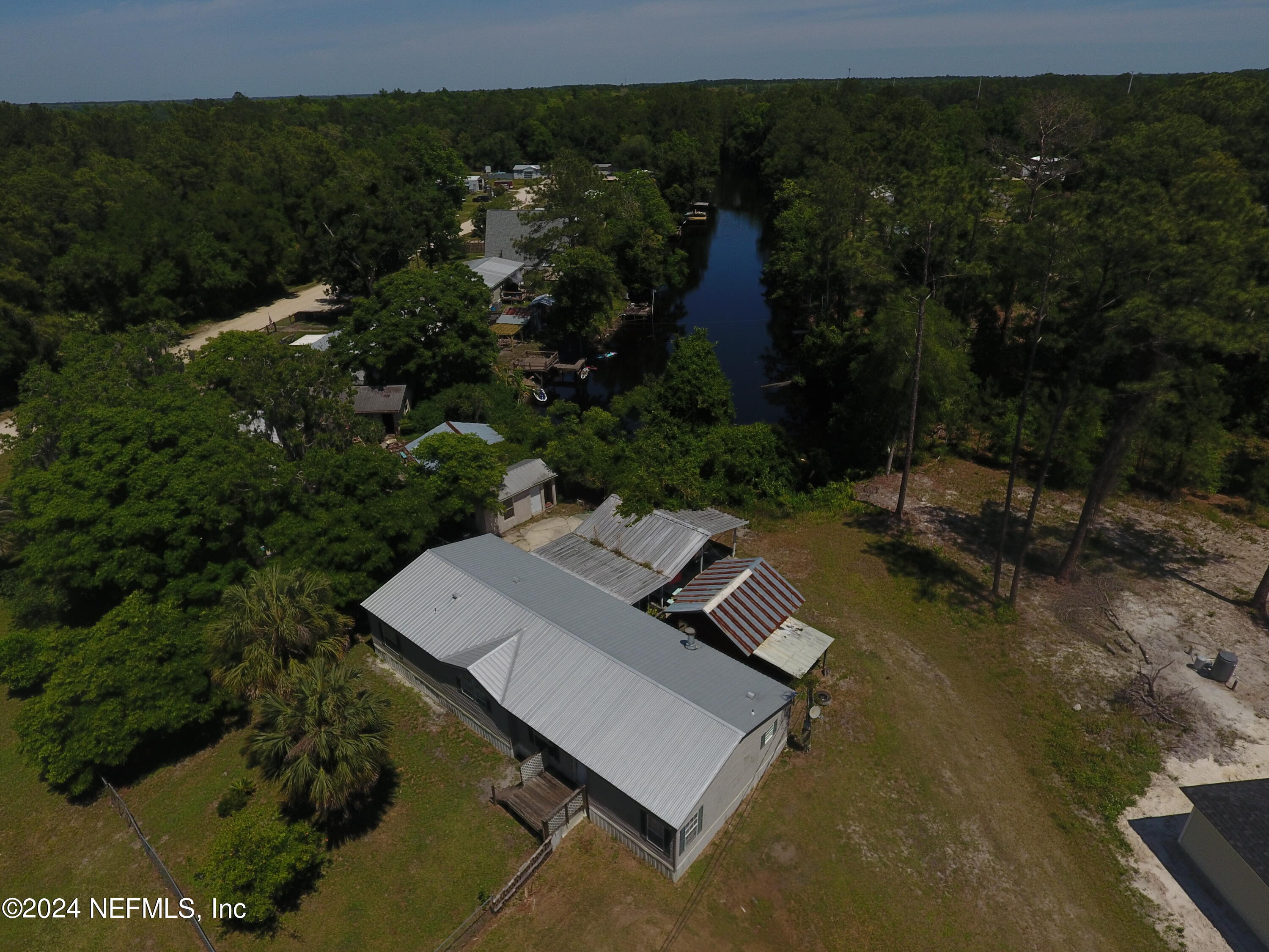 116 Islander Road Satsuma, FL 32189 - Photo 20 of 22 an aerial view of a house with a yard