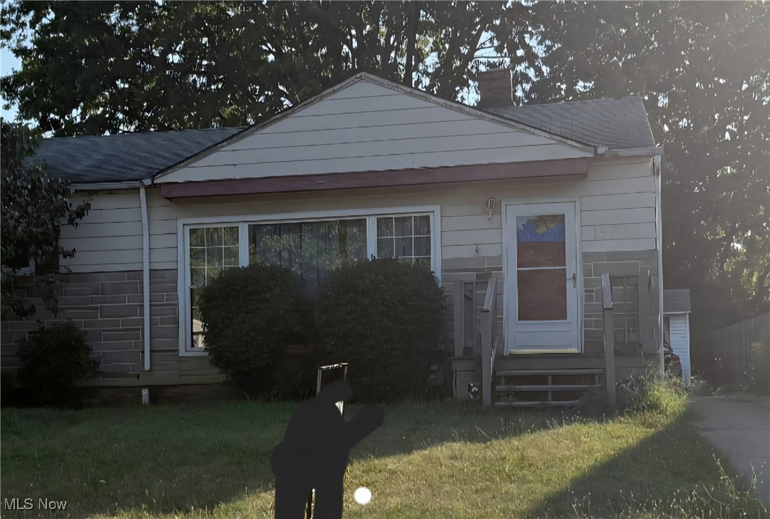 1572 Empire Road Wickliffe, OH 44092 - Photo 1 of 1 View of front of home with a front lawn and a chimney