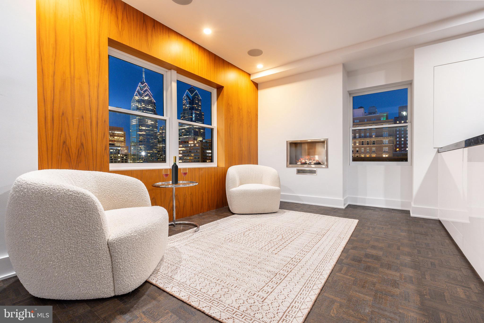 1830 Rittenhouse Square, Unit 17B Philadelphia, PA 19103 - Photo 11 of 39 a bedroom with a large bed and a large window