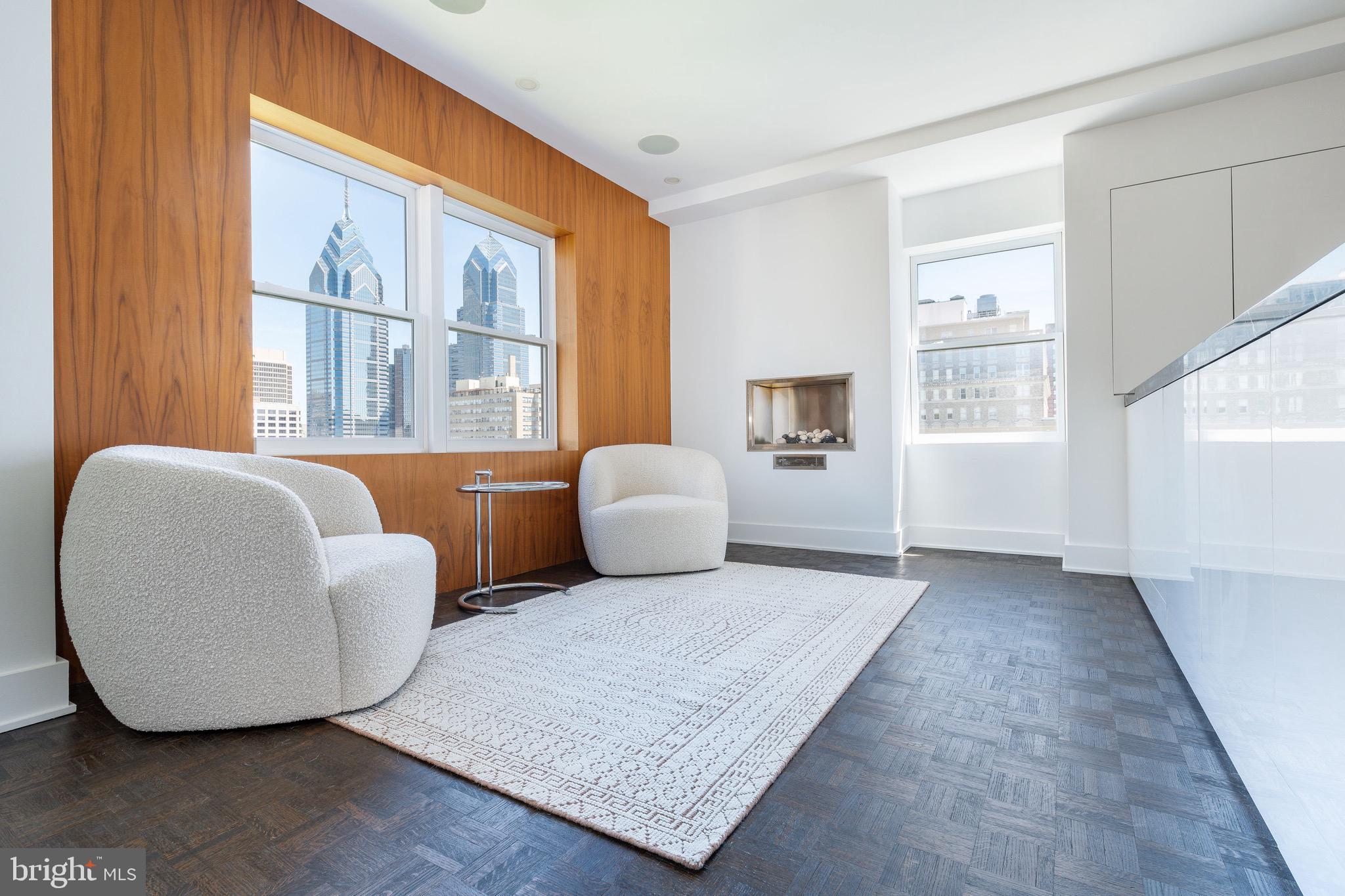 1830 Rittenhouse Square, Unit 17B Philadelphia, PA 19103 - Photo 14 of 39 a living room with furniture and a window