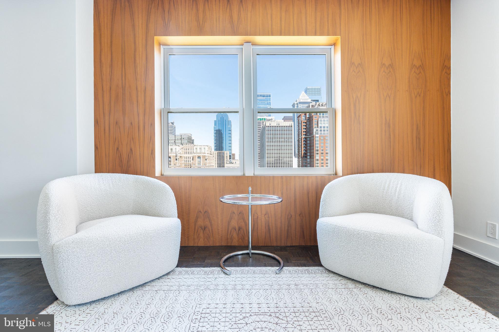 1830 Rittenhouse Square, Unit 17B Philadelphia, PA 19103 - Photo 15 of 39 a living room with furniture and a window