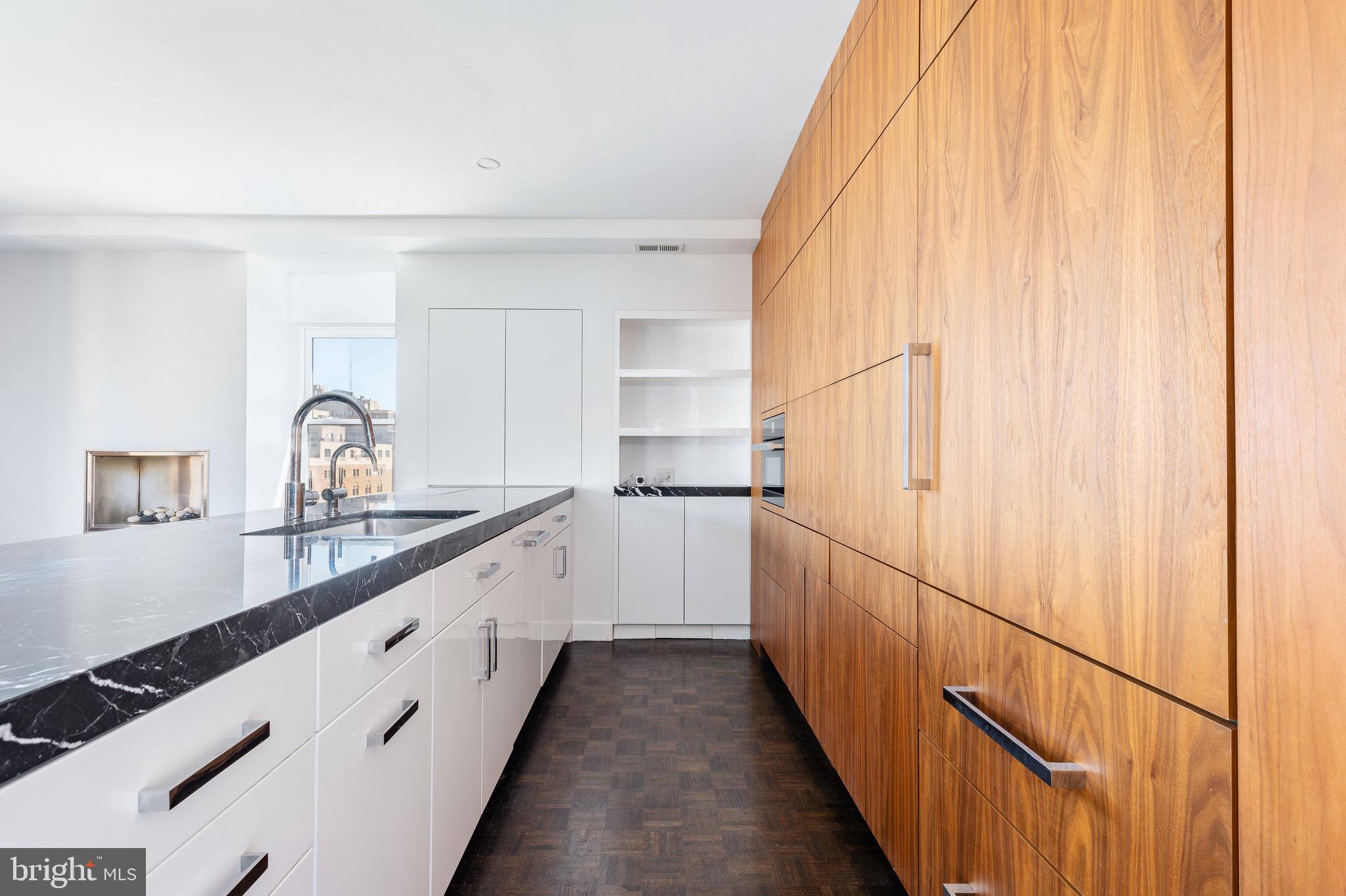 1830 Rittenhouse Square, Unit 17B Philadelphia, PA 19103 - Photo 18 of 39 a kitchen with a sink and cabinets