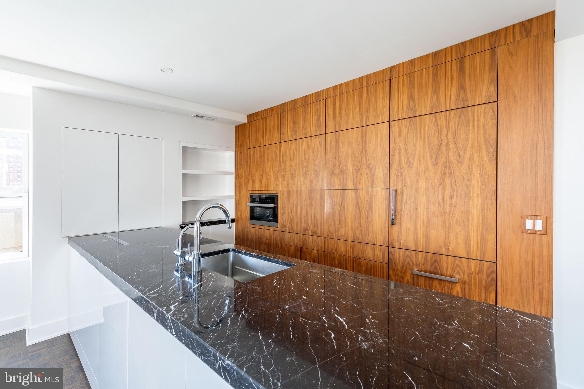 1830 Rittenhouse Square, Unit 17B Philadelphia, PA 19103 - Photo 19 of 39 a room with a table and chairs