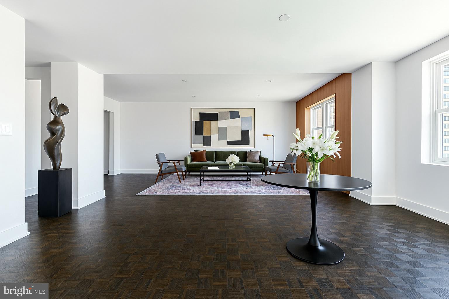 1830 Rittenhouse Square, Unit 17B Philadelphia, PA 19103 - Photo 21 of 39 a living room with furniture hard wood floor and a window