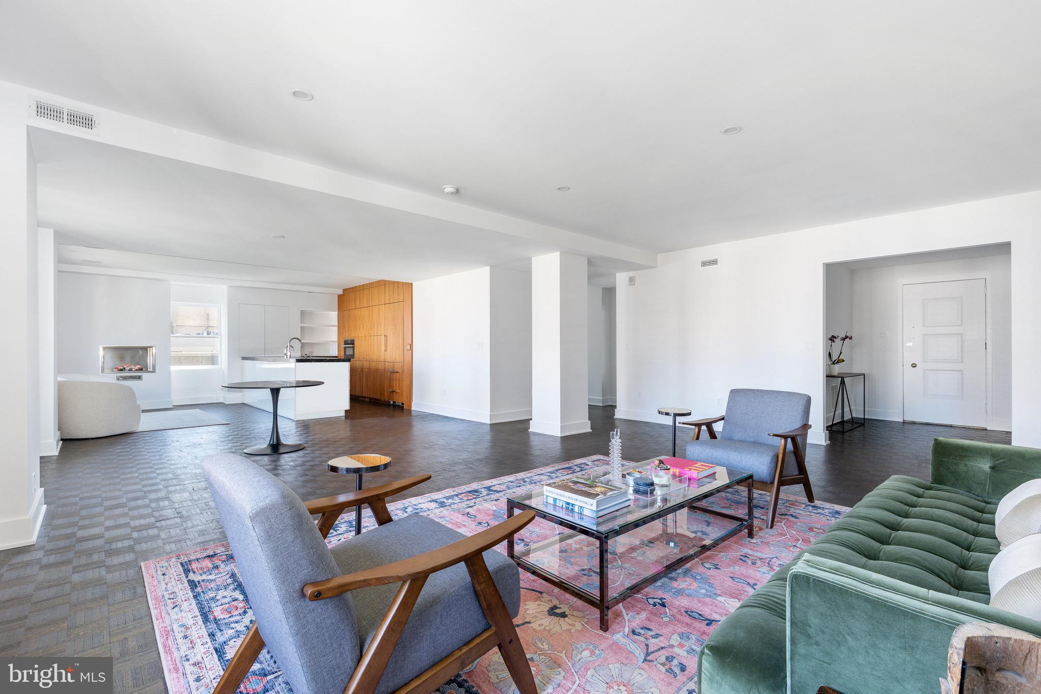 1830 Rittenhouse Square, Unit 17B Philadelphia, PA 19103 - Photo 22 of 39 a living room with furniture and wooden floor