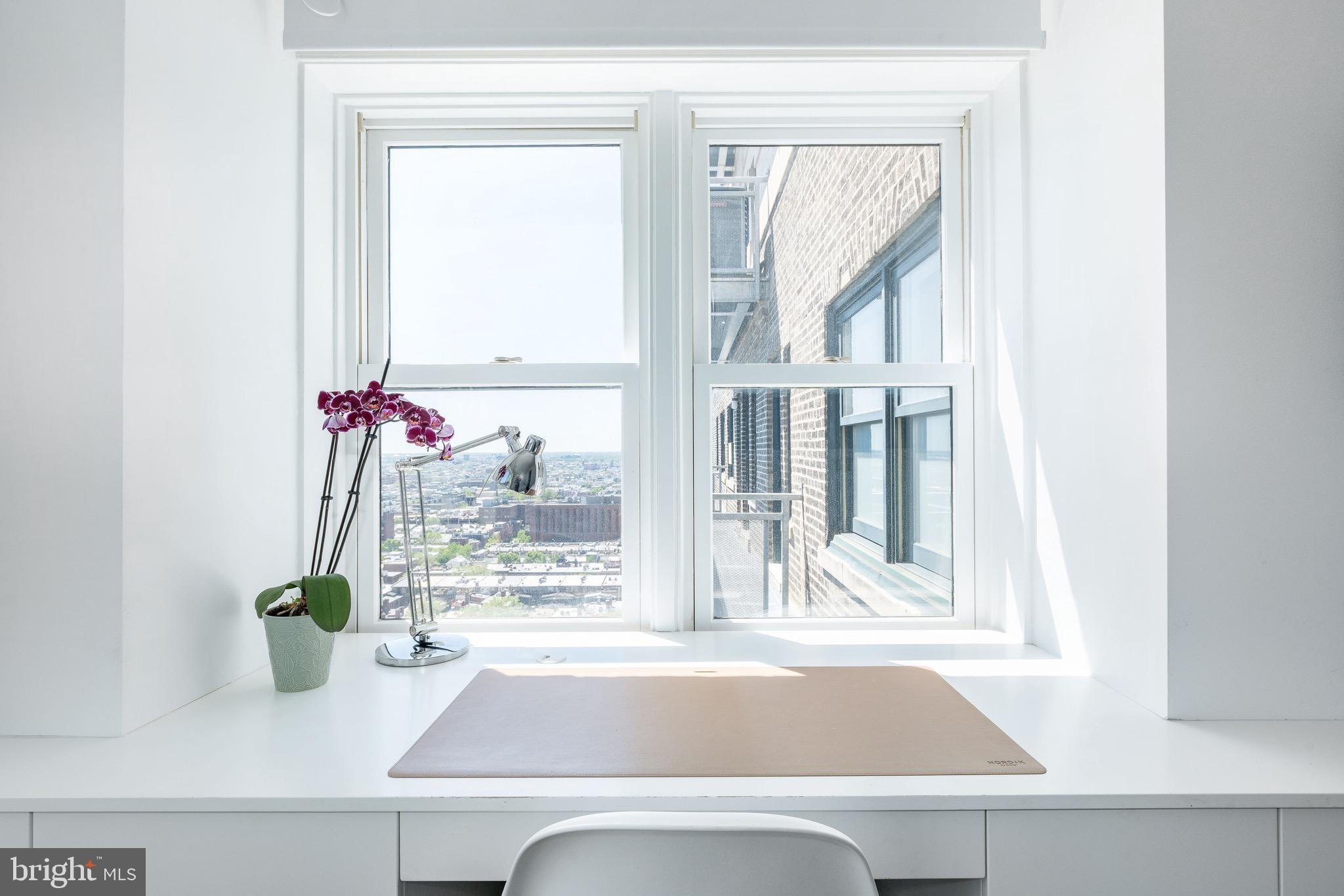 1830 Rittenhouse Square, Unit 17B Philadelphia, PA 19103 - Photo 25 of 39 a vase of flowers sitting on a window sill