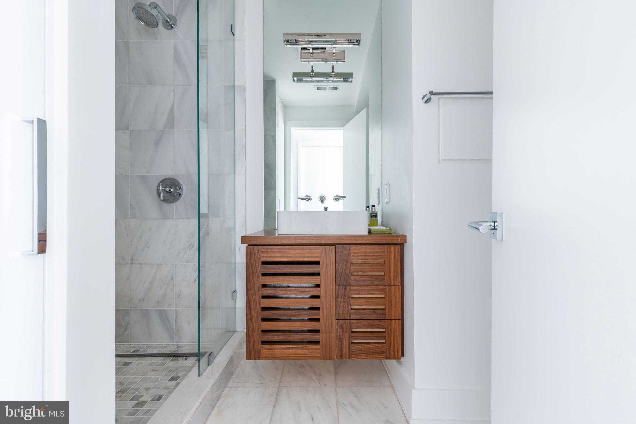1830 Rittenhouse Square, Unit 17B Philadelphia, PA 19103 - Photo 26 of 39 a view of walk in closet with wooden floor