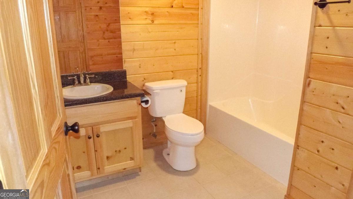 103 K D Lane Ellijay, GA 30540 - Photo 18 of 21 a bathroom with a toilet and a sink