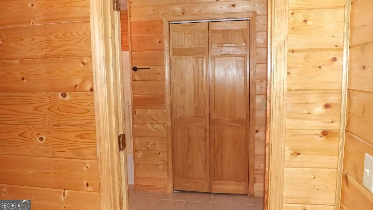 103 K D Lane Ellijay, GA 30540 - Photo 19 of 21 a bathroom with a glass door shower