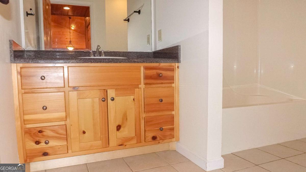 103 K D Lane Ellijay, GA 30540 - Photo 9 of 21 view of kitchen with granite countertop cabinets and window