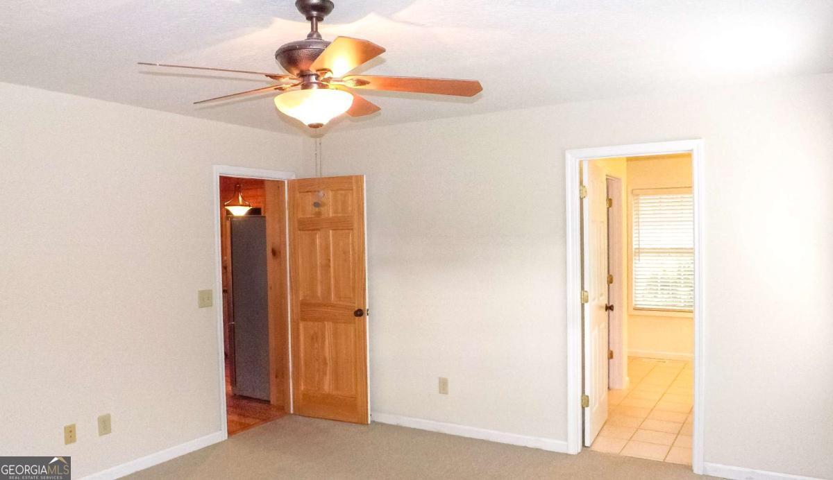 103 K D Lane Ellijay, GA 30540 - Photo 10 of 21 a dining room with chandelier fan and a window