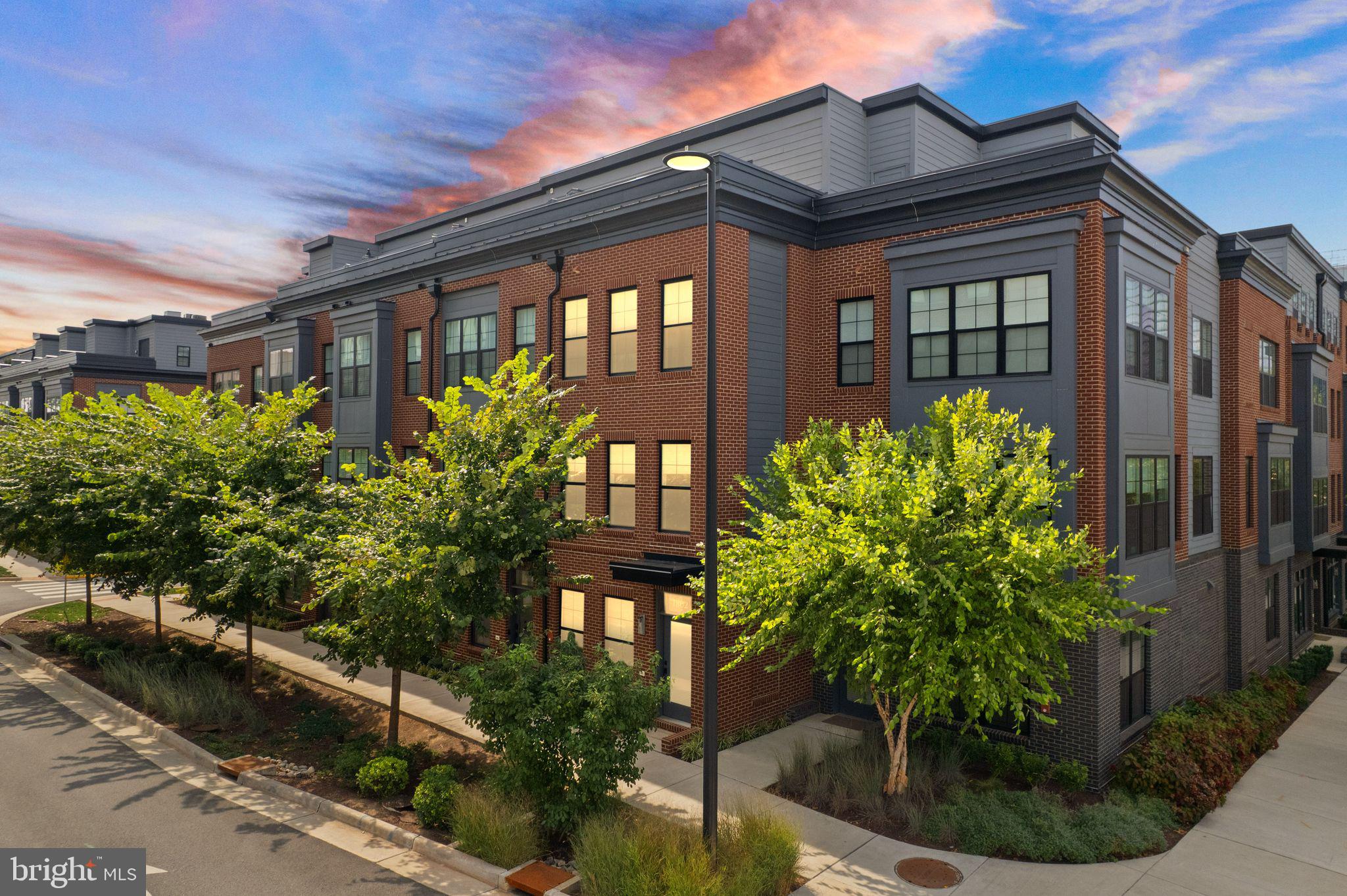 a front view of house and yard with green space