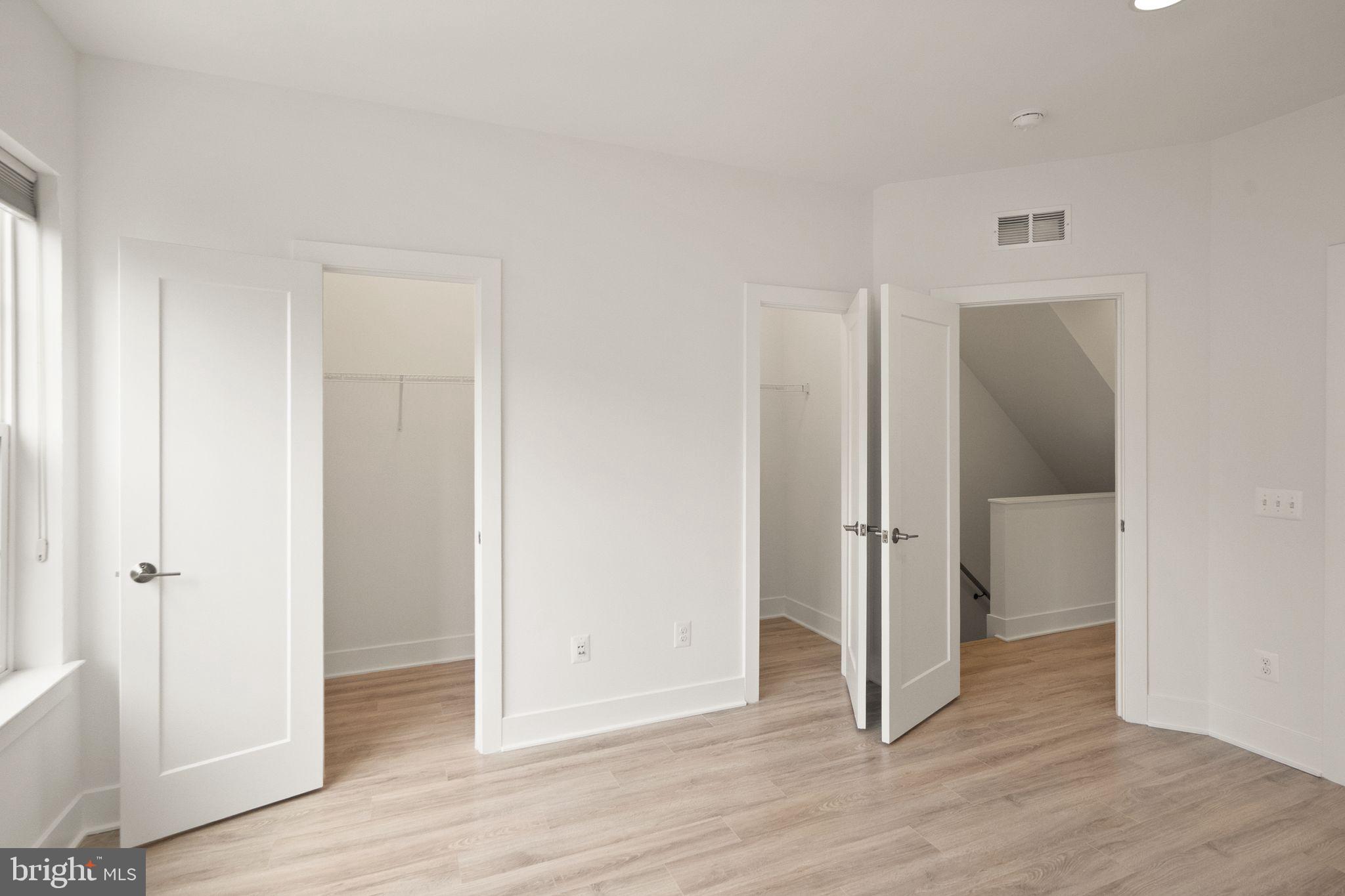 1862 Michael Faraday Drive Reston, VA 20190 - Photo 12 of 35 wooden floor in an empty room