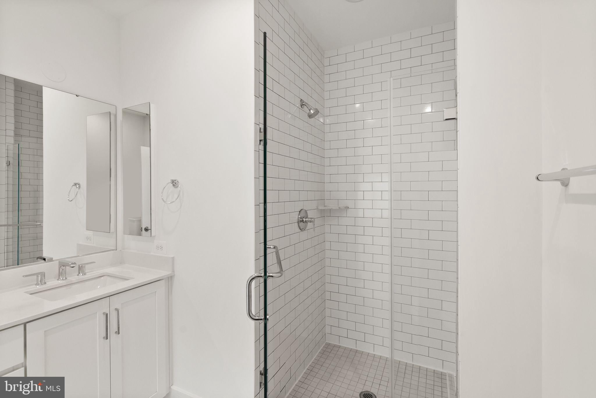 1862 Michael Faraday Drive Reston, VA 20190 - Photo 14 of 35 a bathroom with a shower and a sink