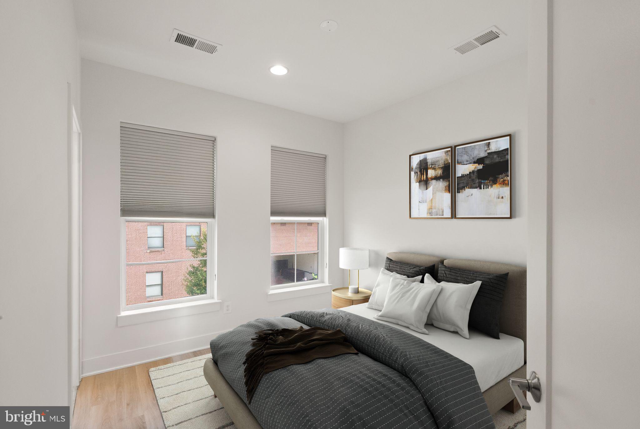 1862 Michael Faraday Drive Reston, VA 20190 - Photo 15 of 35 a bedroom with bed and a window