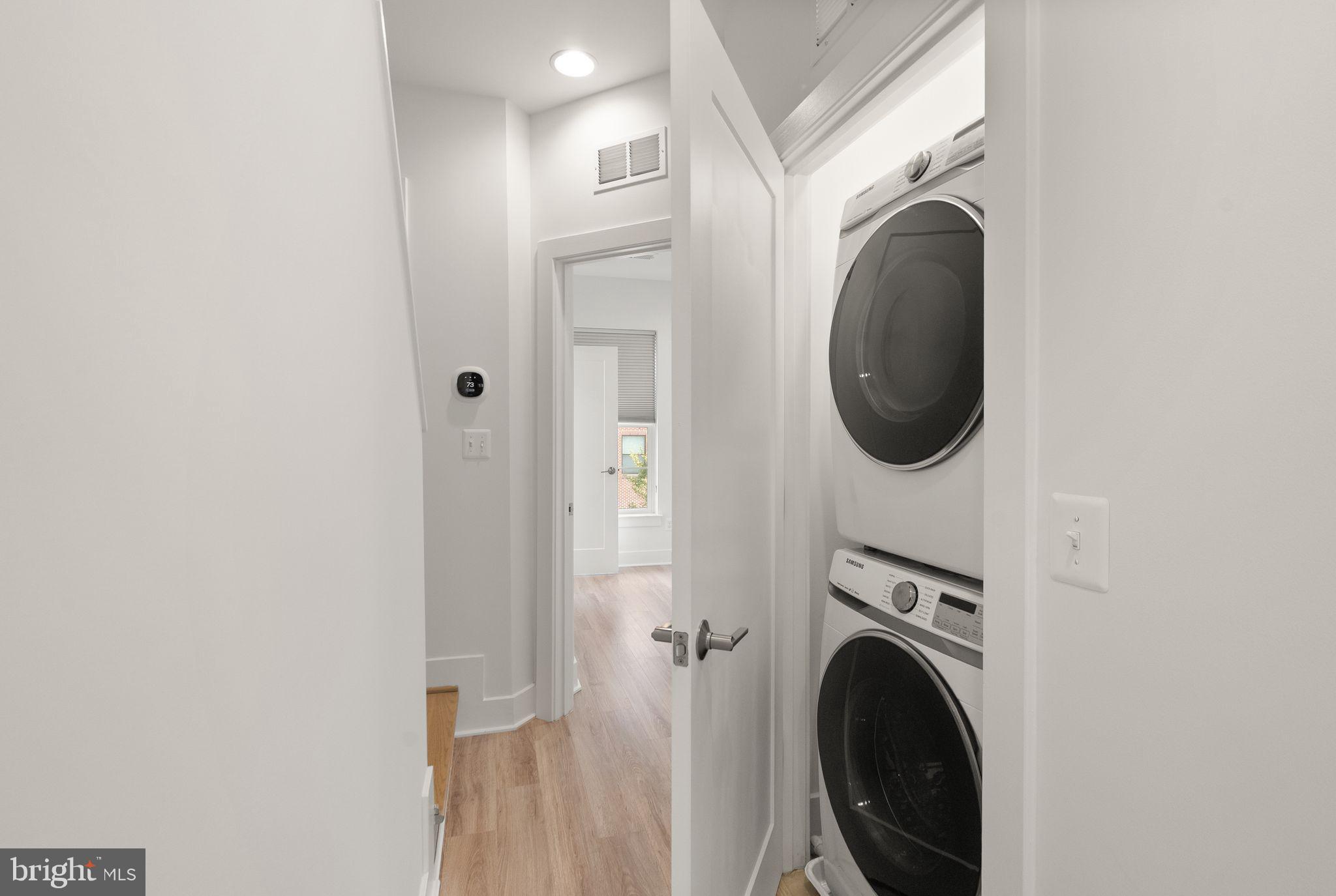 1862 Michael Faraday Drive Reston, VA 20190 - Photo 19 of 35 a view of a hallway with washer and dryer