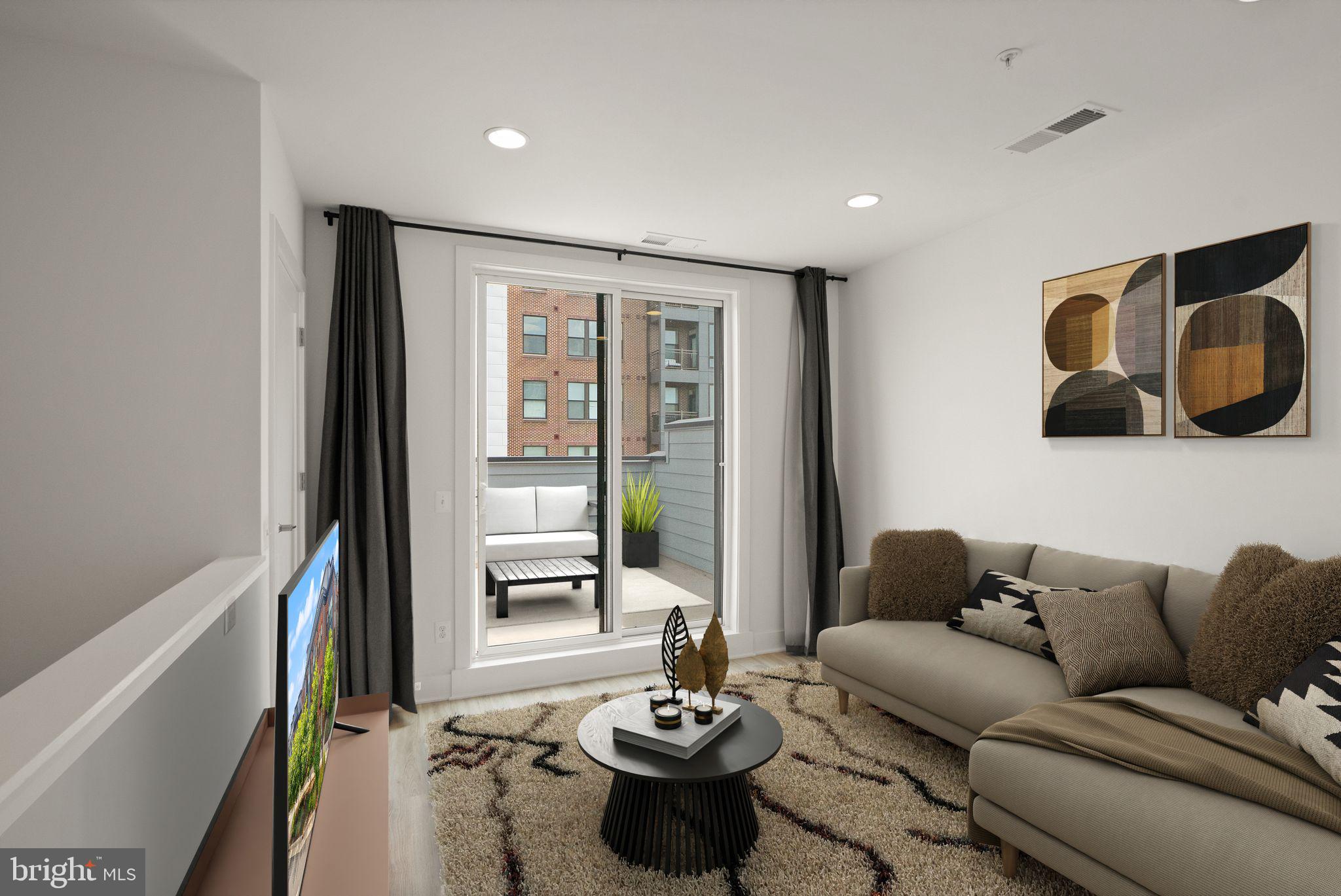 1862 Michael Faraday Drive Reston, VA 20190 - Photo 20 of 35 a living room with furniture and a large window