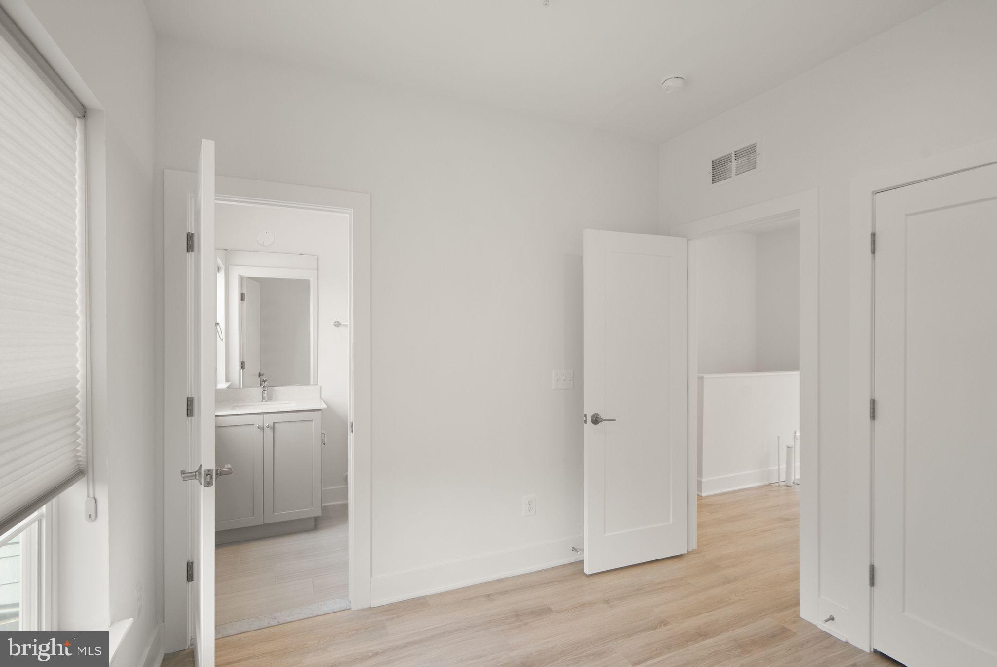 1862 Michael Faraday Drive Reston, VA 20190 - Photo 24 of 35 wooden floor in an empty room