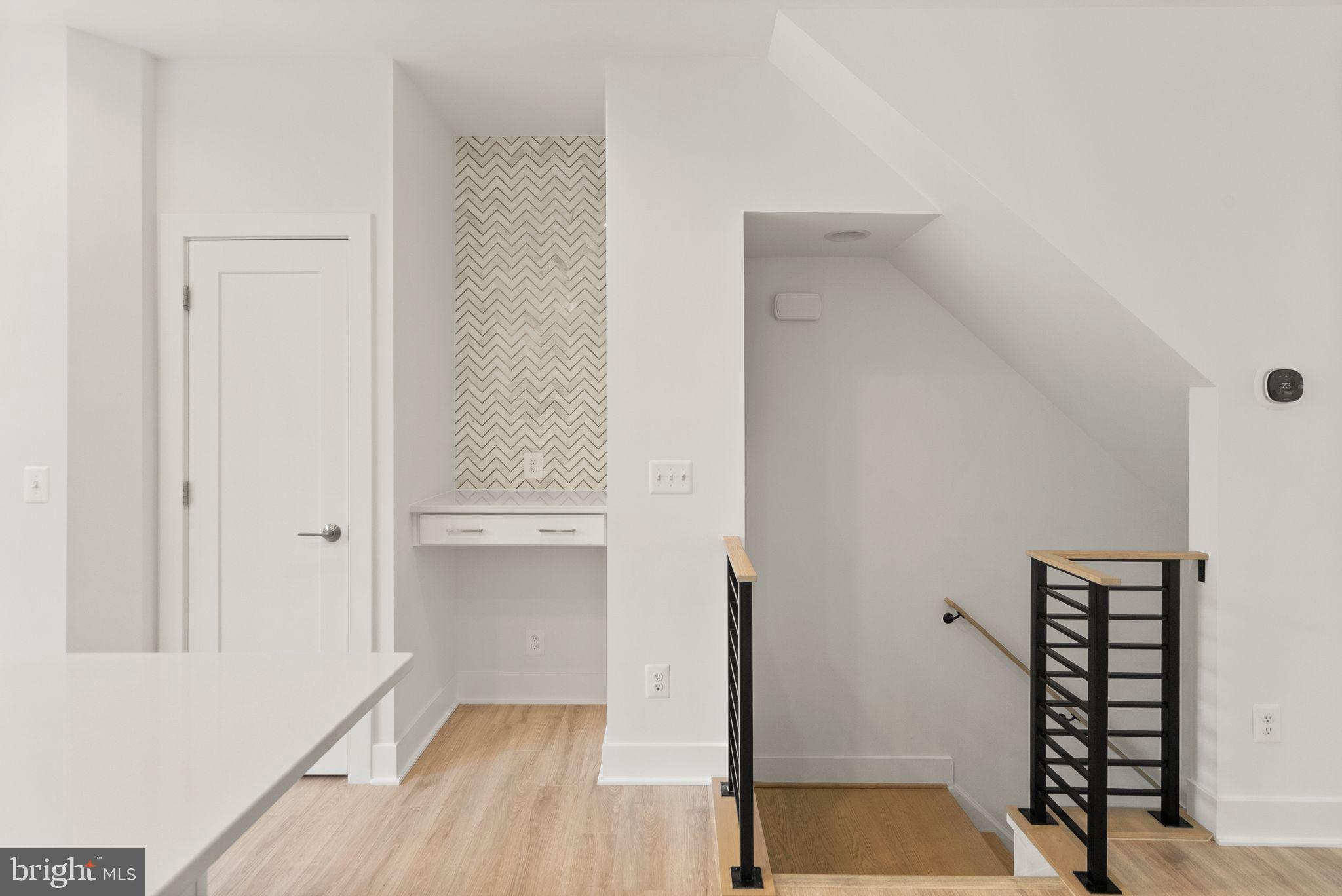 1862 Michael Faraday Drive Reston, VA 20190 - Photo 6 of 35 a view of a room with wooden floor and cabinet