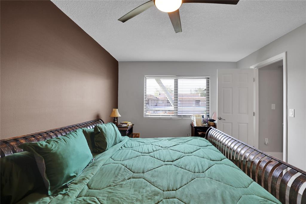 10700 Northwest 30th Place, Unit 7 Sunrise, FL 33322 - Photo 11 of 21 a bedroom with a bed and window