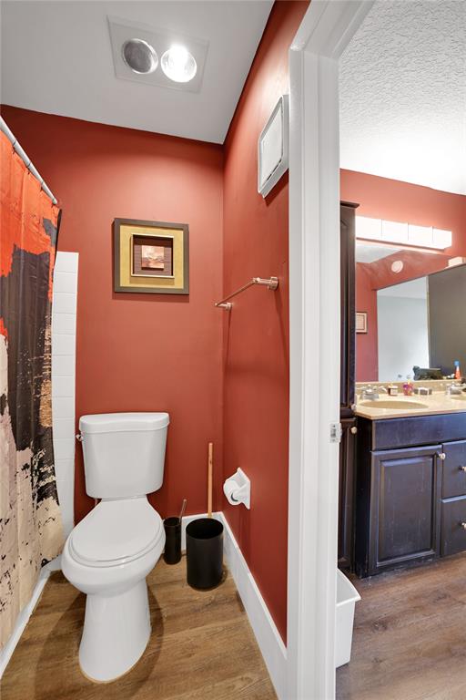10700 Northwest 30th Place, Unit 7 Sunrise, FL 33322 - Photo 14 of 21 a bathroom with a toilet a sink and mirror